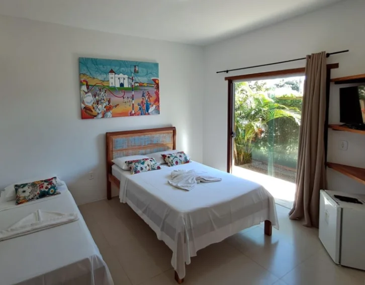 Apartamento com ar-condicionado, TV e frigobar na pousada em Itaúnas